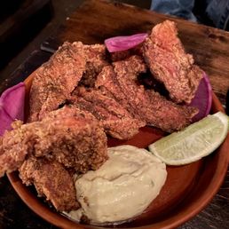 Rupee Bar signature dishes Kerala Fried ChickenDhal Curry with NaanBhel Puri